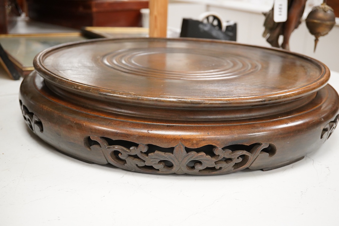 A pair of large Chinese hardwood vase stands, 51cm in diameter